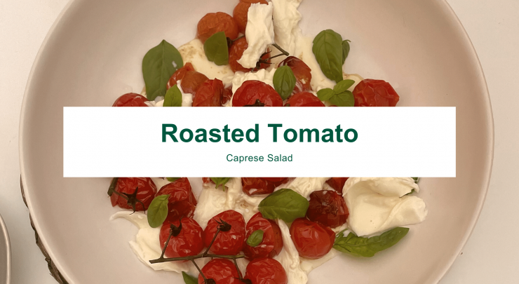 A shallow bowl filled with roasted tomatoes, buffalo burrata and fresh basil